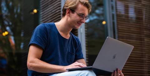  Photo of Man Using Laptop