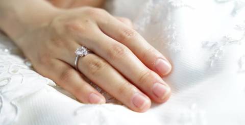 Diamond Studded Ring on a Person's Hand