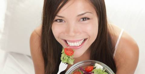 Happy Woman Eating Salads